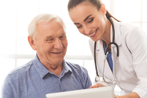 man going over data with doctor