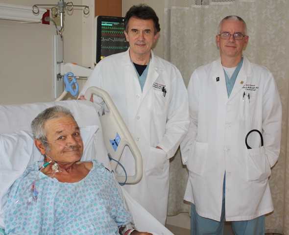 Dr. Nagy and McKnight are standing with Mr. Dewitt, a patient who had a minimally-invasive heart procedure performed.