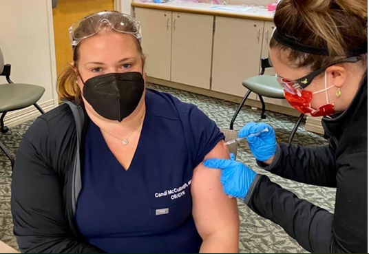 woman getting vaccine