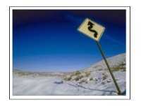 Road Sign leading to a Blue Sky 